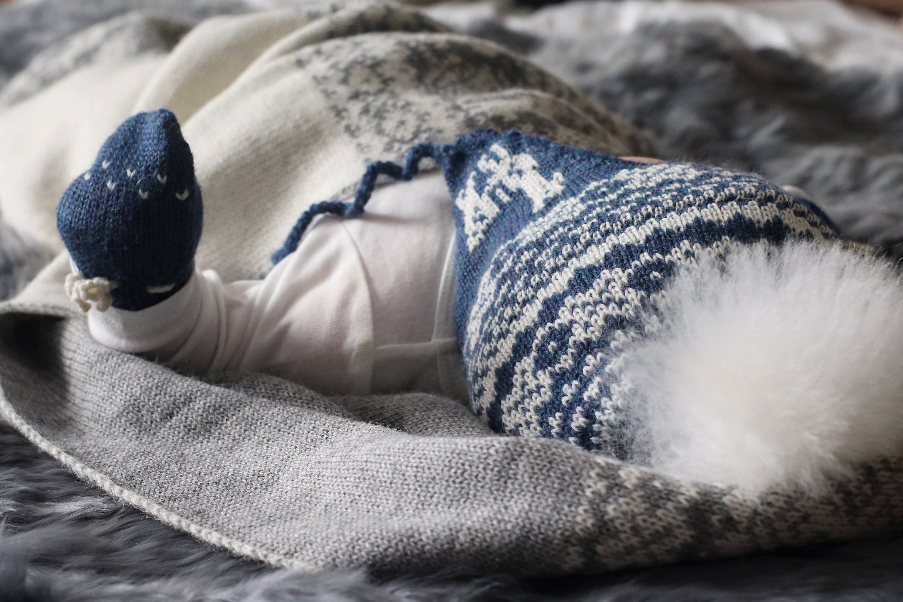 Alpakka Baby Lue med Øreklaffer
